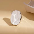 Macro shot of silver resin earrings with oval translucent white stone and smooth finish - Irregular Resin Ring / White/Silver