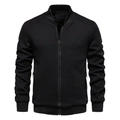 Close-up of black bomber jacket with textured waffle fabric and ribbed stand-up collar - Black
