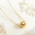 Detailed view of mirror-polished gold sphere pendant on a delicate box chain necklace - Gold Small Polished Sphere