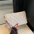 Beige canvas clutch bag with red floral print and brown wrist strap detail - Red Floral / Pink