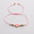 Pulsera de cuerda trenzada rosa con colgante de corazón, perlas y cuentas doradas - Rosa