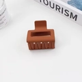 Minimalist square caramel matte hair claw clip shown in a modern home lifestyle setting - 5cm / Orange