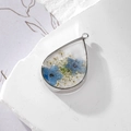 Teardrop resin pendant with blue and white dried flowers and silver metal frame - Blue and White Baby's Breath Teardrop
