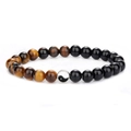 Handmade tiger eye and black onyx beaded bracelet with yin yang charm on white background - Shiny Stone + Tiger Eye
