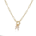 Detail of elegant gold copper necklace with white pearl and Pisces zodiac pendant - Pisces / Gold