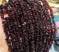 Deep red garnet chip necklace with irregular natural stones held in hand - Bracelet / Garnet