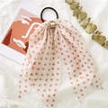 Pink polka dot bow hair tie with gold ring detail on a white linen artistic background - Polka Dot Pink