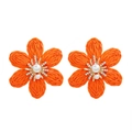 Detail of hand-woven orange raffia flower earrings with white pearl and rhinestones - Orange