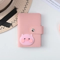Pink faux leather card holder with 26 slots featuring a 3D cute pig snap closure - Pig