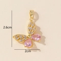 Detailed view of butterfly pendant showing 2.6cm by 2cm dimensions and pink zircon stones - Gold Pink Butterfly