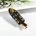 Pinza para pelo de Halloween con calabaza y sombrero de bruja sobre purpurina negra y oro - Sombrero Mágico de Calabaza