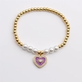 Pulsera elástica de perlas blancas y cuentas doradas con dije de corazón en esmalte púrpura - Morado