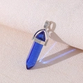Blue hexagonal crystal point pendant with a silver metallic bail and hanging ring - Blue Crystal