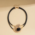 Detail of double-layer black choker necklace with gold spiral pendant and black resin stone - Necklace - Gold