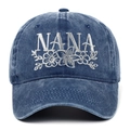 Close-up of NANA embroidery and white floral patterns on vintage washed denim baseball cap - Adjustable / Navy Blue