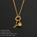 Elegante roestvrijstalen ketting met cursief 'J' initiaal en geel kristallen bedeltje - Letter J