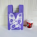 Detail of purple knitted tote bag featuring a white and dark purple butterfly pattern - Butterfly Purple
