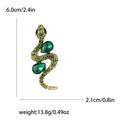 Dettagli della spilla a serpente con strass verdi, misure 6,0 cm per 2,1 cm - Base dorata / Verde
