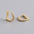 Macro detail of S925 sterling silver stamp and zircon micro-pave on D-letter earrings - 925 Silver / Gold