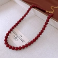 Close-up of vintage deep red round bead necklace with adjustable gold extension chain - 8mm Dark Red Round Bead Style (31#) / Red