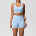 Two-piece light blue yoga set with racerback sports bra and high-waisted shorts with pockets - Sky Blue