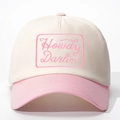 Detailed embroidery of Howdy Darlin text on a pink and cream cotton baseball cap - Adjustable / Off-white and Pink