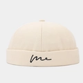 Detail of beige docker hat with minimalist 'me' script embroidery on the folded edge - Adjustable / Beige