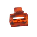 Detail of square amber resin claw clip with metal spring and tortoiseshell texture - Red Leopard Print