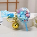 Lollipop keychain with blue snowflake sequins and gold bell on white background - Snowflake Lollipop [Blue]