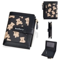 Short black women's wallet featuring cute beige bear print and secure snap closure - Black