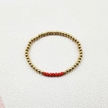Detailed view of elastic handmade bracelet with golden steel beads and red faceted crystals - Gold Red Faceted Beads 4mm (YB-1012RED-4mm)