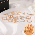 14-piece gold ring set featuring star, moon, and relief portraits on white silk background - Portrait Relief Gold Stackable Ring Set (2272)