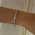 Detail of silver stainless steel cube link bracelet worn by a model on soft fabric - Cube Shape Square Style (B280) / Silver
