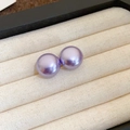 Elegant purple pearl stud earrings with 18k gold plating on a beige velvet display - Oval Style (Diameter 14mm) / Purple