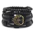 Dettaglio di bracciali multistrato in pelle nera con ciondoli bronzo dell'albero della vita - Perline Nere Albero di Bronzo