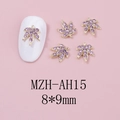 Macro detail of purple rhinestone maple leaf nail charms with gold alloy base and 8x9mm size - Gold Base Purple Rhinestone (AH15)