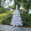 Close-up of white artificial mini Christmas tree with a plastic tripod base outdoors - No Light Style / 60CM