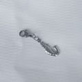 Detailed shot of silver stainless steel starfish pendant with lobster clasp on fabric - Shrimp