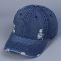Close-up of distressed details and worn-out effects on washed denim baseball cap - M (56-58cm) / Dark Blue