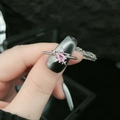 Pink pear-shaped diamond butterfly ring in silver finish with star accents on band - Style 7-Pear with Star