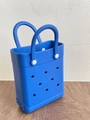 Detail of blue EVA beach tote with signature perforation and white circular handle studs - Blue