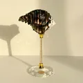 Artistic shell ornament with dark brown stripes on a crystal base with gold accents - Starry Sky Gold Black Murex