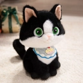 Süße schwarz-weiße Katzen-Plüschfigur mit grünen Augen und einem Cupcake-Lätzchen - Kuchen / 35cm