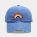 Close-up of rainbow embroidery on washed cotton blue baseball cap with curved brim - Adjustable / Sky Blue