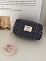 Quilted black and white checkered cosmetic bag with heart pattern and fabric label - Blue