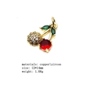 Macro detail of gold cherry pendant with cubic zirconia and red crystal gems - Size 8