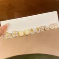 6-pair set of floral pearl stud earrings with enamel details and gold finish on card - 6 Pairs Set / Gold White Set