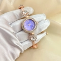 Detail of rose gold watch with purple dial, crystal bezel and floral rhinestone bracelet - Purple