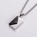 Macro detail of envelope pendant necklace in silver and black with cubic zirconia - Steel + Black (With Chain)