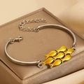 Silver bracelet with six yellow enamel fish charms on a jewelry box with lobster clasp - Silver Yellow Enamel Small Fish Bracelet (N-1053)